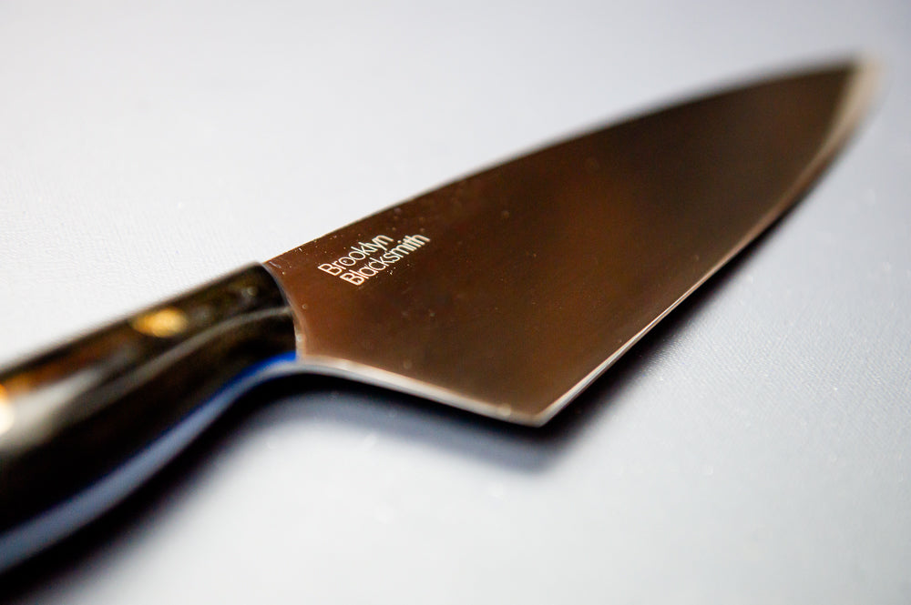Classic Chef's Knife- Black Micarta with Blue Liners and Brass Mosaic Pin